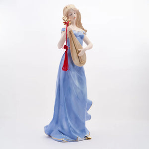 WOMAN PLAYING THE MANDOLIN